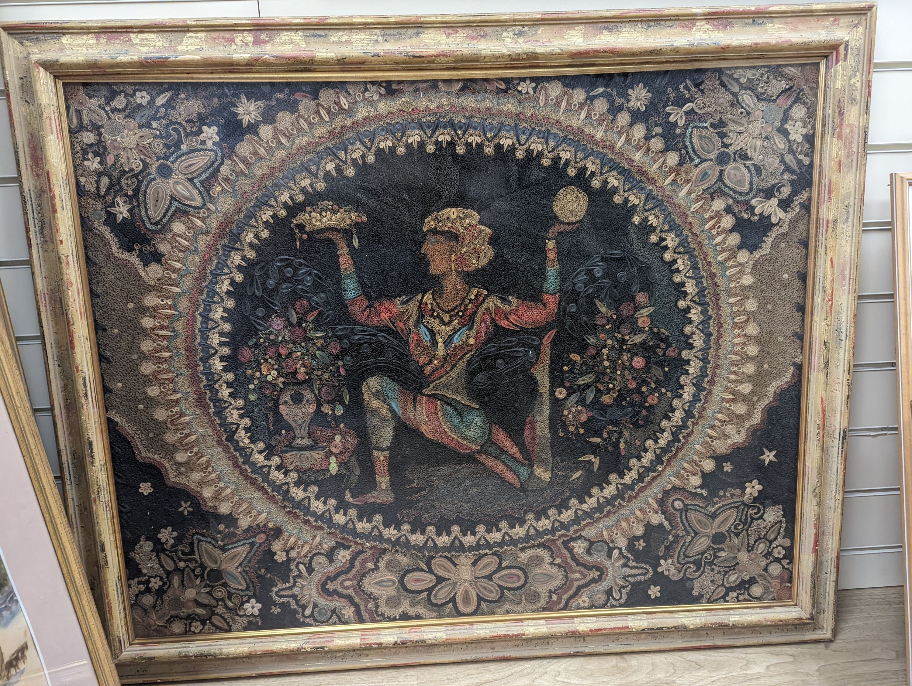 A large paper scrollwork panel depicting and Indian dancer and flowers, 70 x 90cm